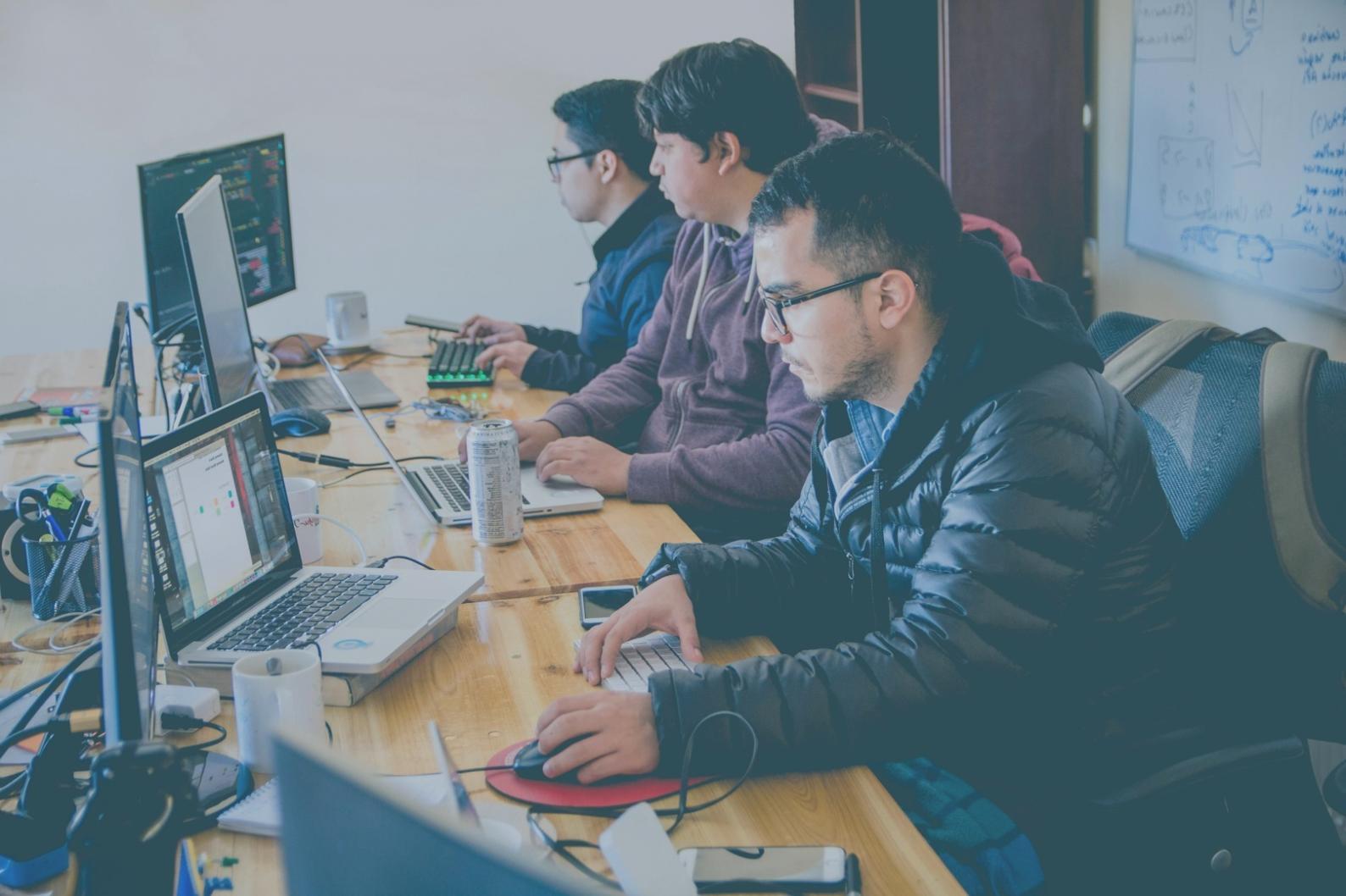 Professional mobile app testing setup with multiple devices and testing equipment