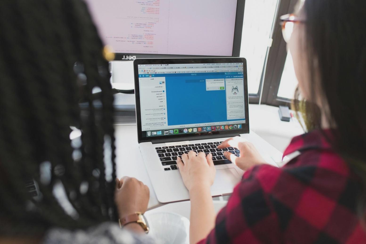 Team member testing mobile applications on multiple devices in professional environment